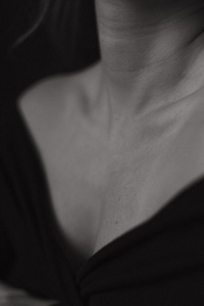 A close up of a person wearing a necklace
