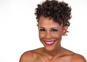 Deep Plane vs. SMAS Facelift: smiling woman with black hair