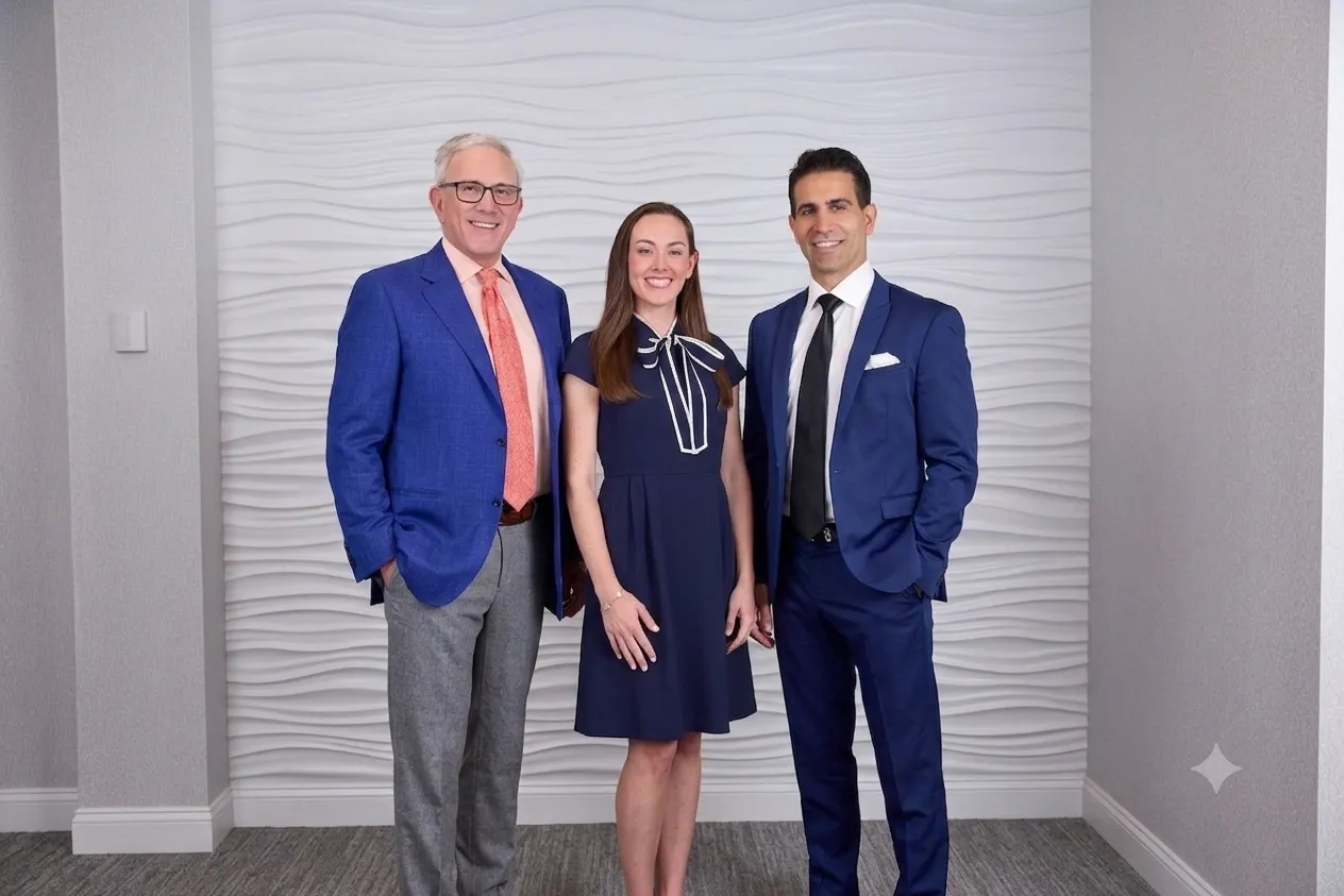 NSCS-Doctor-Group-Romanelli-Walsh-Layliev standing Drs. James Romanelli, Amanda Walsh, and John Layliev of North Shore Cosmetic Surgery